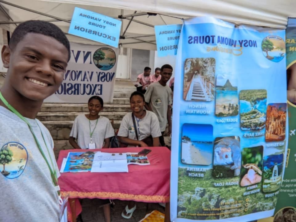 Welcoming cruise passengers at our tent